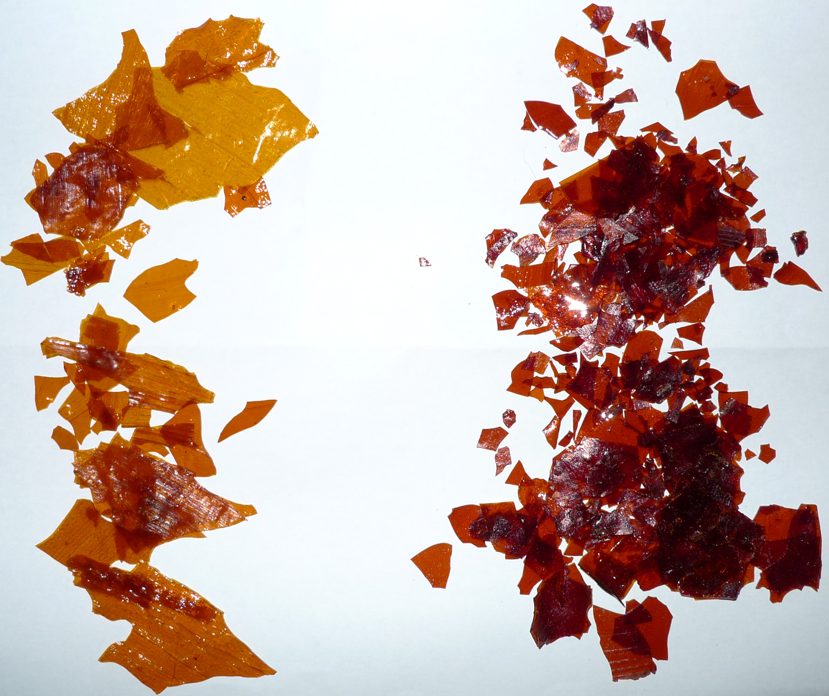 Figure 4 — Shellac in its raw form: orange flakes on the left, garnet on the right. The flakes are dissolved in alcohol to make the finish, and the choice of grade sets the colour the wood ends up — orange be…